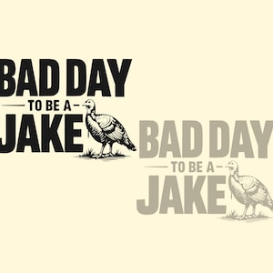 May include: A graphic design featuring the text "BAD DAY TO BE A JAKE" in bold, black letters. A detailed illustration of a turkey stands to the right of the text. A faded version of the design is in the background.