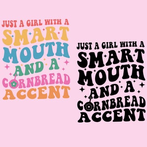 May include: A colorful graphic design with the text "Just a girl with a smart mouth and a cornbread accent". The text is in a retro style with a pink background.