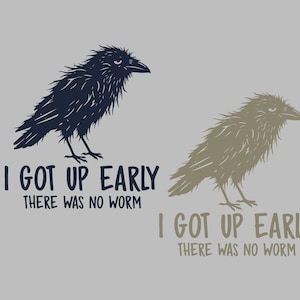 May include: A graphic illustration featuring two shaggy birds. The left bird is dark blue with the text I GOT UP EARLY THERE WAS NO WORM in dark blue. The right bird is light brown with the same text in light brown. Both birds have a grumpy expression.