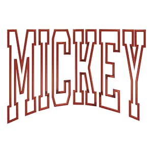 May include: A brown, block-lettered word "MICKEY" in a curved, arched design. The letters are outlined with a thick border, creating a dimensional effect. The background is plain white.