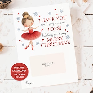 May include: A white gift card holder with a ballerina illustration and the text "THANK YOU for keeping me on my TOES! Wishing you a very MERRY CHRISTMAS!". Includes a space for a gift card and the words "Gift Card Here".