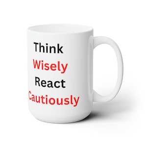 May include: White ceramic coffee mug with the text "Think Wisely React Cautiously" in black and red lettering.