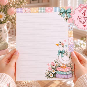 May include: A lined notepad page featuring a white background with a patchwork border of pastel floral and gingham patterns. A teal bow sits at the top right corner. A white goose wearing a floral crown and teal bow stands on a stack of books.