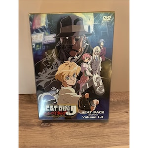 May include: A Heat Guy J DVD box set titled Heat Pack containing volumes 1-3. The cover features an anime illustration of a character in a fedora, a blonde character holding a handgun, and other figures against a dark, urban city background.