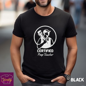 May include: Black t-shirt with a white graphic of a plumber holding a wrench. The text "CERTIFIED Poop Toucher" is printed below the graphic.