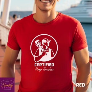 May include: Red t-shirt with a white graphic of a plumber holding a wrench and the text "CERTIFIED Poop Toucher".