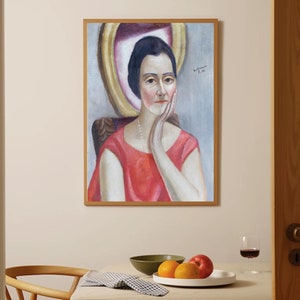 May include: A framed painting of a woman in a red dress, with a pearl necklace, sitting in a chair. The woman is looking to the side and has her hand on her chin. The painting is set against a light blue background.