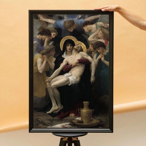 May include: A painting depicting a scene of the Pieta, with Mary cradling the body of Jesus. The painting is framed in a dark wood frame and features a group of angels surrounding the figures.