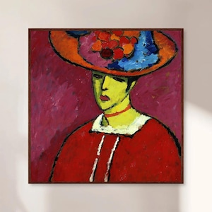Könnte beinhalten: Ein Gemälde einer Frau, die einen großen, bunten Hut mit roten, blauen und gelben Blumen trägt. Sie trägt ein rotes Kleid mit weißen Akzenten und hat ein grünes Gesicht.