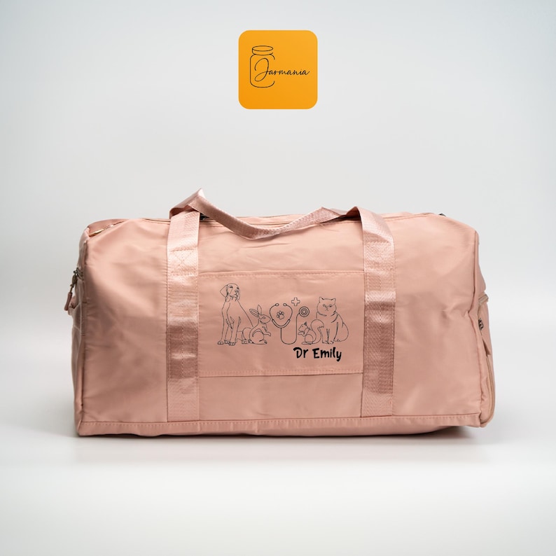 a pink duffel bag with a picture of a dog on it