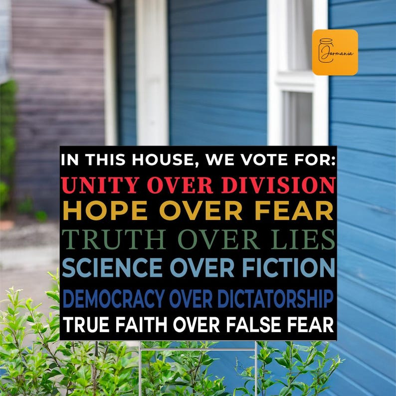 a sign in front of a blue house that says in this house we vote for