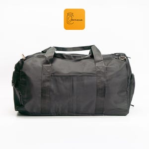 a duffel bag sitting on top of a white floor