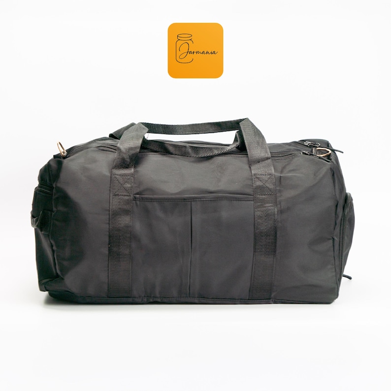 a duffel bag sitting on top of a white floor
