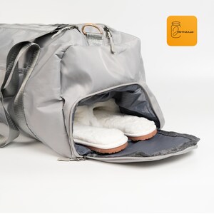 a gray bag with a pair of slippers in it