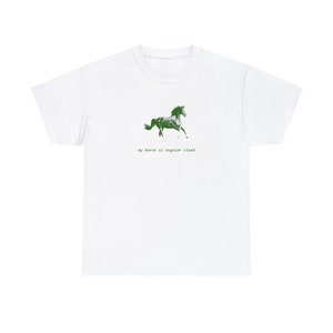 May include: White t-shirt with a green silhouette of a horse running and the text "my horse is regular sized".