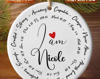 May include: White ceramic ornament with the words "I am Nicole" in black script. The ornament is decorated with a red heart and a circle of inspirational words and bible verses in black text.