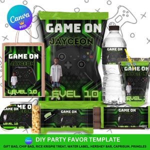 Peut inclure: Ensemble de cadeaux de fête sur le thème du jeu vidéo. Le design présente un graphisme de manette noire, le texte "GAME ON JAYCEON" et "LEVEL 10" en vert et blanc. Les articles comprennent un sac cadeau, un sachet de chips, une bouteille d'eau et des emballages de bonbons.
