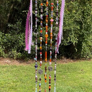 Purple and orange glass bead suncatcher