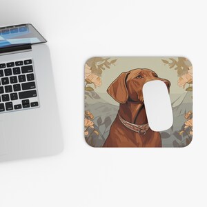 May include: A brown and white dog with a floral background. The dog is looking to the right and has a collar on. The background is a light green with flowers in shades of pink and yellow.