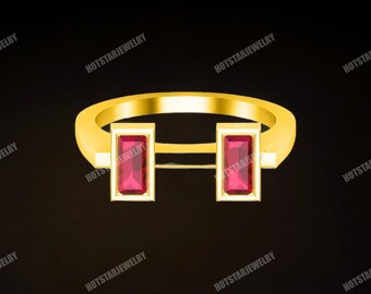 Könnte beinhalten: Ein goldener Ring mit zwei rechteckigen roten Edelsteinen, die in die Band gefasst sind.