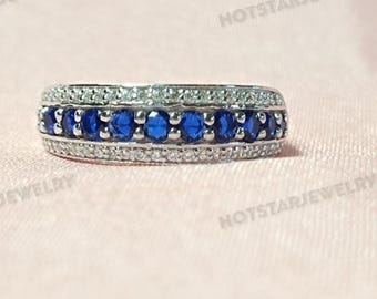 Art Deco-vigselring i sterlingsilver med blå safir och diamanter