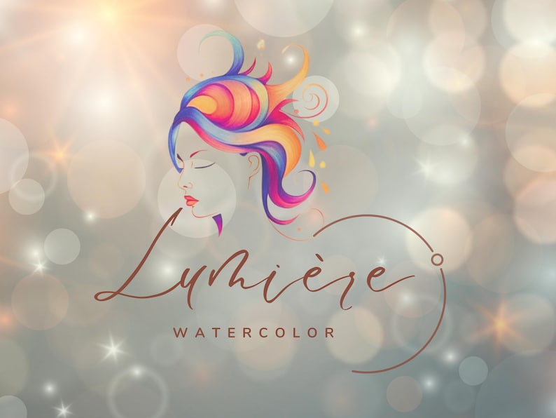 Op de afbeelding: Een kleurrijke aquarel-illustratie van een vrouwen gezicht met golvend haar, met de tekst "Lumi&egrave;re Watercolor" eronder.