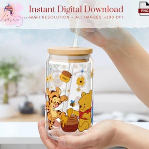 May include: A clear glass jar with a wooden lid and a straw. The jar has a Winnie the Pooh and Tigger design with the words "Honey" and flowers.