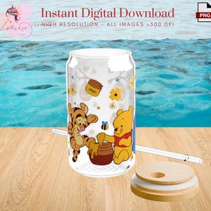 May include: A clear glass tumbler with a Winnie the Pooh and Tigger design. The tumbler has a straw and a lid. The design features Winnie the Pooh and Tigger with a pot of honey and flowers.