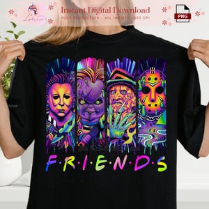 May include: Black t-shirt featuring a vibrant graphic of four horror movie characters. The design includes Michael Myers, Chucky, Freddy Krueger, and Jason Voorhees, with the word "FRIENDS" in colorful letters.