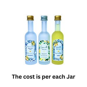 May include: Three small limoncello bottles with gold, silver, and gold caps. Each bottle has a label with text and a lemon design. The bottles are filled with clear and yellow liquid. The labels read "Limoncello Made with Love" and "Limoncello With Love".