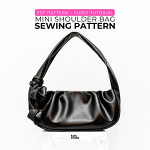 May include: A black mini shoulder bag sewing pattern with a video tutorial. The bag has a gathered design and a knotted handle. The text "PDF PATTERN + VIDEO TUTORIAL MINI SHOULDER BAG SEWING PATTERN" is displayed in the image.