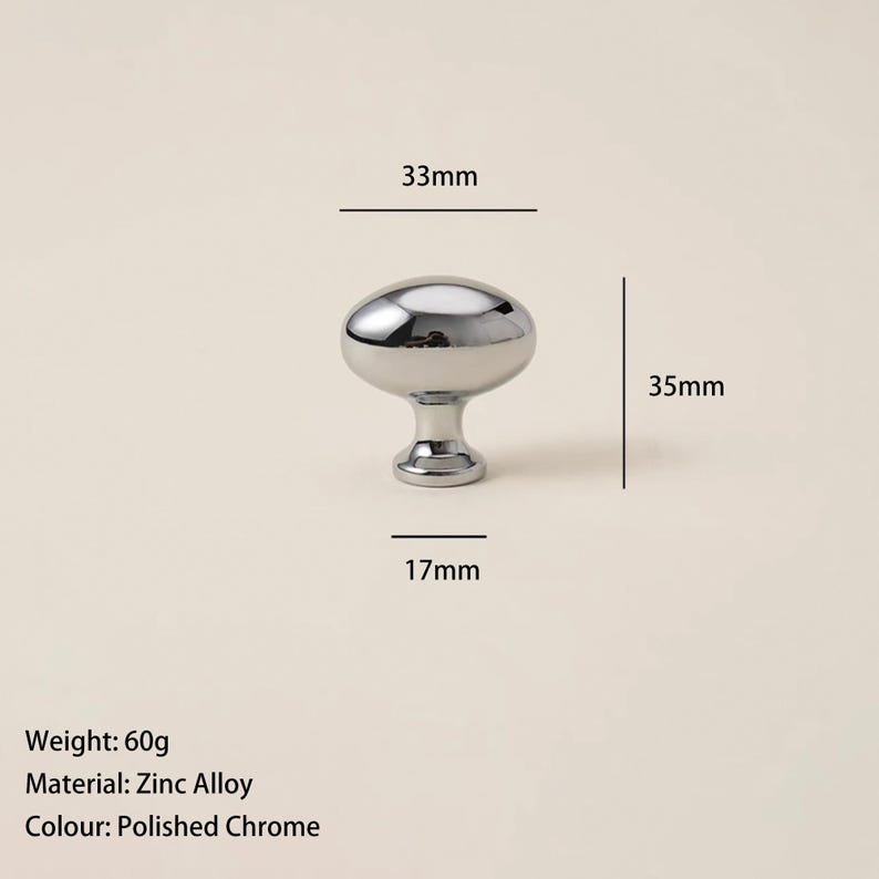 May include: A polished chrome cabinet knob made of zinc alloy. The knob is oval-shaped, measuring 33mm wide and 35mm tall. The base is 17mm wide. The knob weighs 60g. Suitable for furniture hardware.