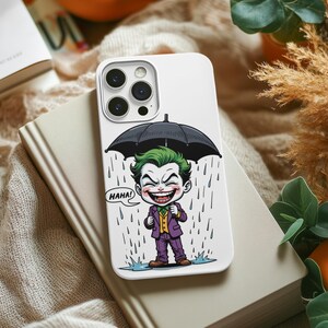 A white iPhone case with a cartoon image of a joker character holding an umbrella and laughing, surrounded by a rainy scene.