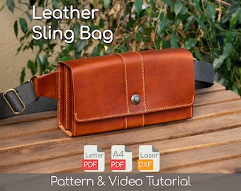 May include: A tan leather sling bag with a black strap and buckle. The bag is rectangular with a flap closure and visible stitching. The text "Leather Sling Bag" is at the top, and "Pattern & Video Tutorial" is at the bottom.