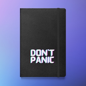 May include: Black notebook with the words "DON'T PANIC" in white with a blue and pink shadow effect. The notebook has a black elastic band closure.