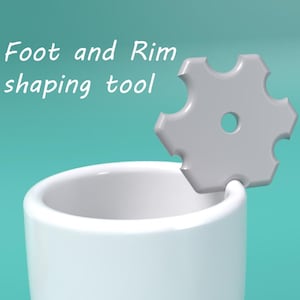 May include: A white ceramic cup with a gray, star-shaped tool resting on the rim. The text "Foot and Rim shaping tool" is written above the cup.