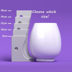 May include: White ceramic vase with a rounded bottom and a wide opening. Choose which size: 8 cm, 10 cm, 12 cm, 14 cm, or 16 cm.
