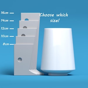 May include: White ceramic vase with a wide base and a narrow top. The vase is shown next to a set of five white rectangular blocks with holes. The blocks are labeled with measurements in centimeters: 8 cm, 10 cm, 12 cm, 14 cm, and 16 cm. The text "Choose which size!" is written above the vase.