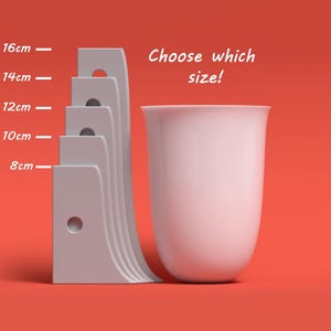 May include: A white ceramic vase with a rounded bottom and a wide opening. The vase is shown next to a set of five grey plastic wall mounts, each with a different size hole. The wall mounts are labelled with measurements in centimetres: 8cm, 10cm, 12cm, 14cm, and 16cm. The text "Choose which size!" is written above the vase.