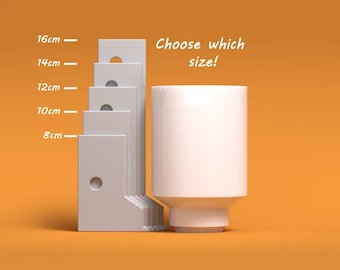 May include: White ceramic vase with a rounded base and a wide opening. Choose which size! The vase is shown next to a ruler with measurements in centimetres: 8 cm, 10 cm, 12 cm, 14 cm, and 16 cm.
