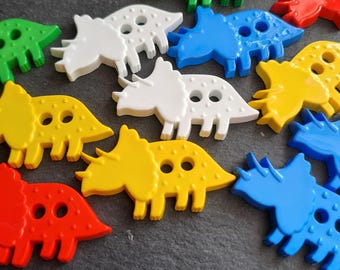 Triceratops Dinosaur nylon button 37mm 2 holes. Six colours available. Sold individually so that you can mix and match.