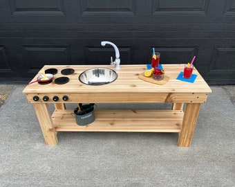 Simple mud kitchen with working faucet