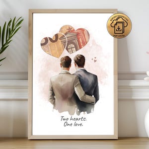 Può includere: Una stampa artistica incorniciata con un'illustrazione ad acquerello di due figure che si abbracciano, con due disegni a forma di cuore sopra di loro. I cuori contengono elementi architettonici. Il testo "Two hearts. One love." è in basso.