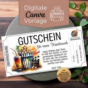 Puede incluir: Un vale de regalo blanco para cine con el texto alemán "GUTSCHEIN für einen Kinobesuch" y una ilustración de acuarela de palomitas de maíz, una bebida y una bobina de película. El vale incluye texto en alemán.