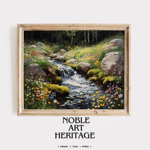 May include: A framed landscape painting depicts a stream cascading over rocks, surrounded by colorful wildflowers and lush greenery. The artwork features a light-colored wooden frame and the text "NOBLE ART HERITAGE" at the bottom.