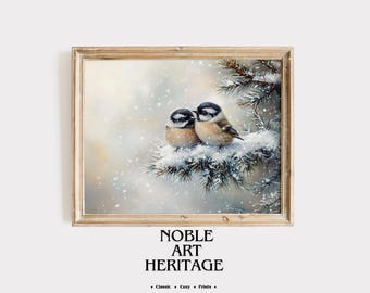 May include: A framed print featuring two small birds perched on a snow-covered evergreen branch. The birds have black and white heads and tan bodies. The print is labeled "NOBLE ART HERITAGE" with the words "Classic • Cozy • Prints."