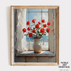 May include: A framed painting depicts a still life of red roses in a white pitcher on a windowsill. The window overlooks a blue ocean and sky. A white curtain hangs to the left. The painting is signed "Noble Art Heritage".