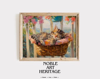 May include: A framed painting depicts a tabby kitten sleeping peacefully in a wicker basket lined with a pink cloth. The background shows a white fence, flowers, and a blue sky. The painting is labeled "NOBLE ART HERITAGE".