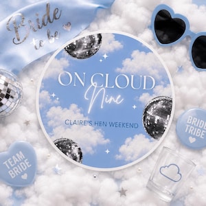 May include: A collection of hen party decorations in light blue and silver. Features a sash, heart-shaped sunglasses, disco balls, and a round sign with the text "On Cloud Nine" and "Claire's Hen Weekend".