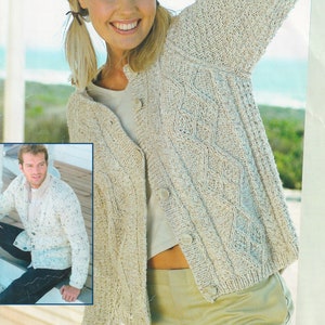 May include: A cream-colored knitted cardigan with a cable knit pattern. The cardigan has a button-up front and is worn by a person with blonde hair. The text "DENIM Sport Aran" is visible in the top left corner of the image.